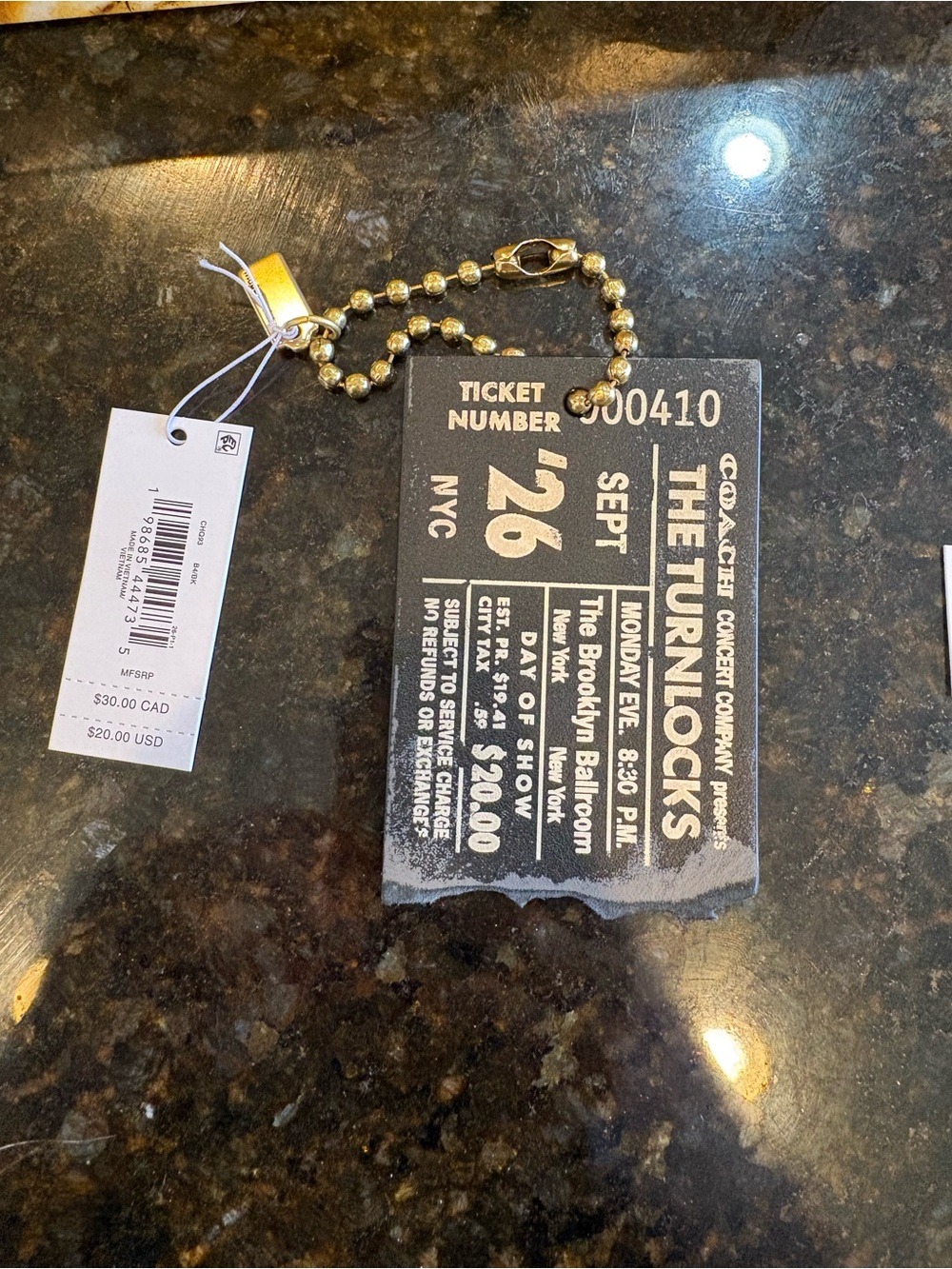Coach ticket bag charm